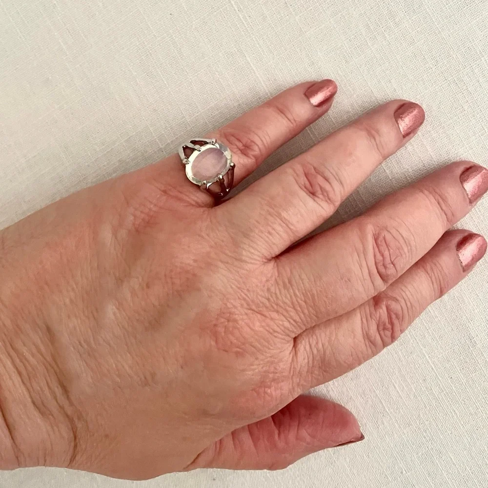 A clear white oval stone on a silvertone ring, US size  6 1/4-6 1/2, NEW